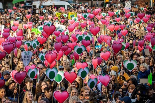 Sea of hearts by The Only Animal, at October 25 climate rally in Vancouver, photo by CBC.